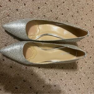 Ladies silver high heels. Size 8.5. Michael kors. New without tags.